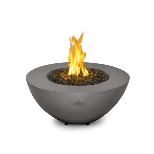 Half egg shaped concrete fire pit with flames on a white background