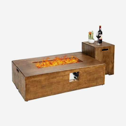 Wooden fire pit table with flames and a side table with a bottle and glasses on a white background