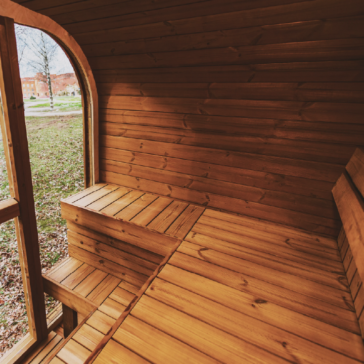 Interior view of wooden sauna with a slight view of the outside